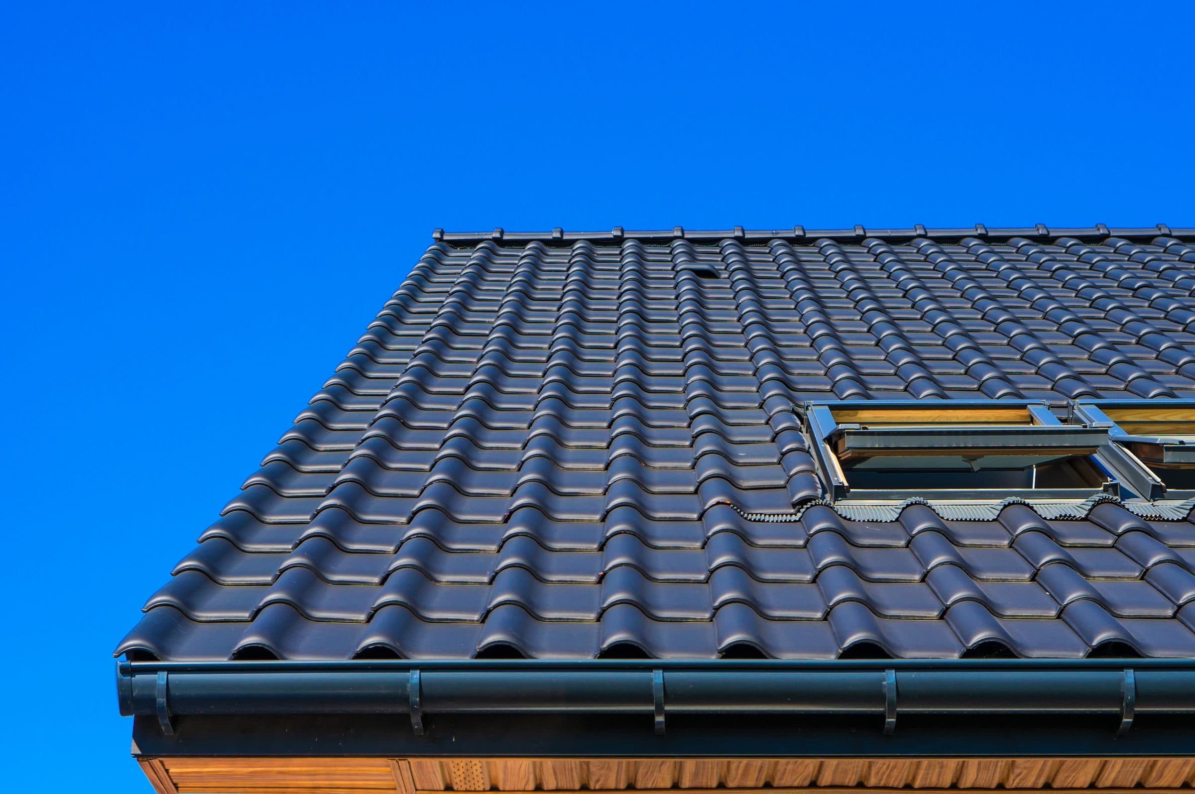 Tiled roof of a house with a skylight